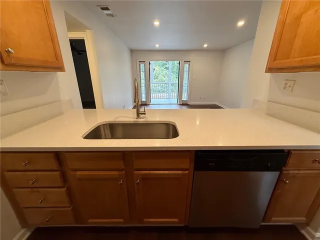 a kitchen with a sink and cabinets