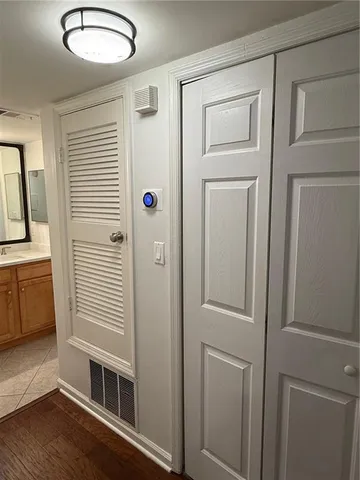 a view of a hallway with entryway door