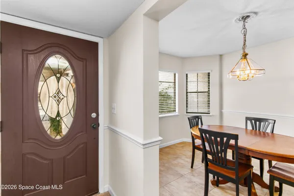a view of a dining room with furniture window and outside view