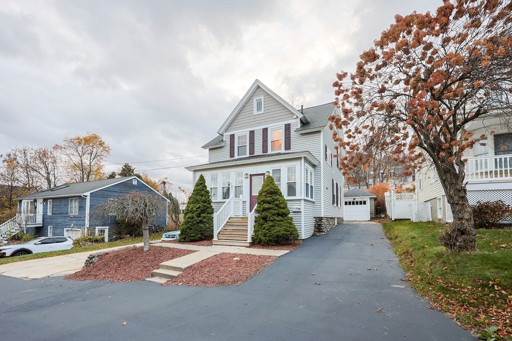 11 Hockanum Way Worcester, MA 01606 - Photo 1 of 36 a front view of a house with a yard and garage