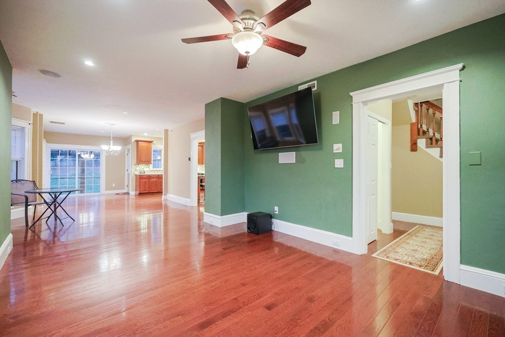 11 Hockanum Way Worcester, MA 01606 - Photo 14 of 36 a view of a livingroom with furniture wooden floor a ceiling fan and front door