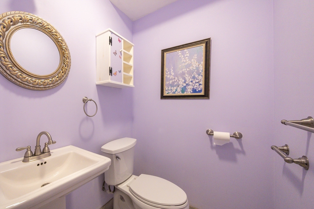 11 Hockanum Way Worcester, MA 01606 - Photo 15 of 36 a bathroom with a toilet a sink and a mirror