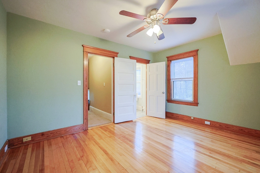11 Hockanum Way Worcester, MA 01606 - Photo 17 of 36 a view of empty room with wooden floor and fan