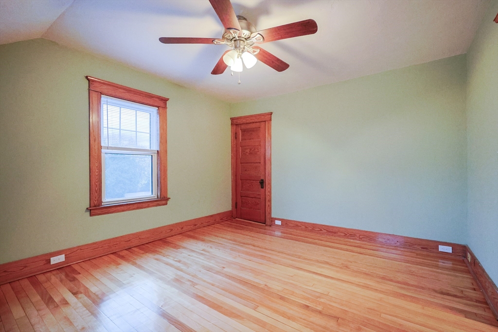 11 Hockanum Way Worcester, MA 01606 - Photo 18 of 36 a view of an empty room with window and chandelier fan