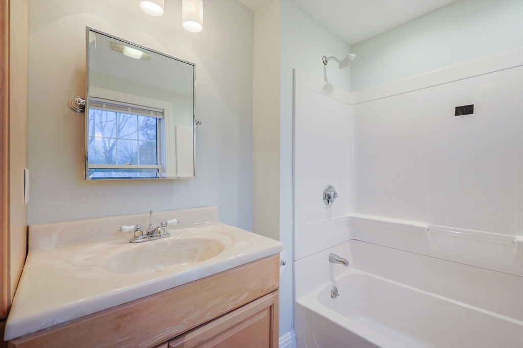 11 Hockanum Way Worcester, MA 01606 - Photo 19 of 36 a white bath tub sitting next to a white sink and vanity