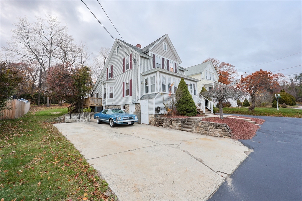 11 Hockanum Way Worcester, MA 01606 - Photo 2 of 36 a view of a white house with a large space and a yard