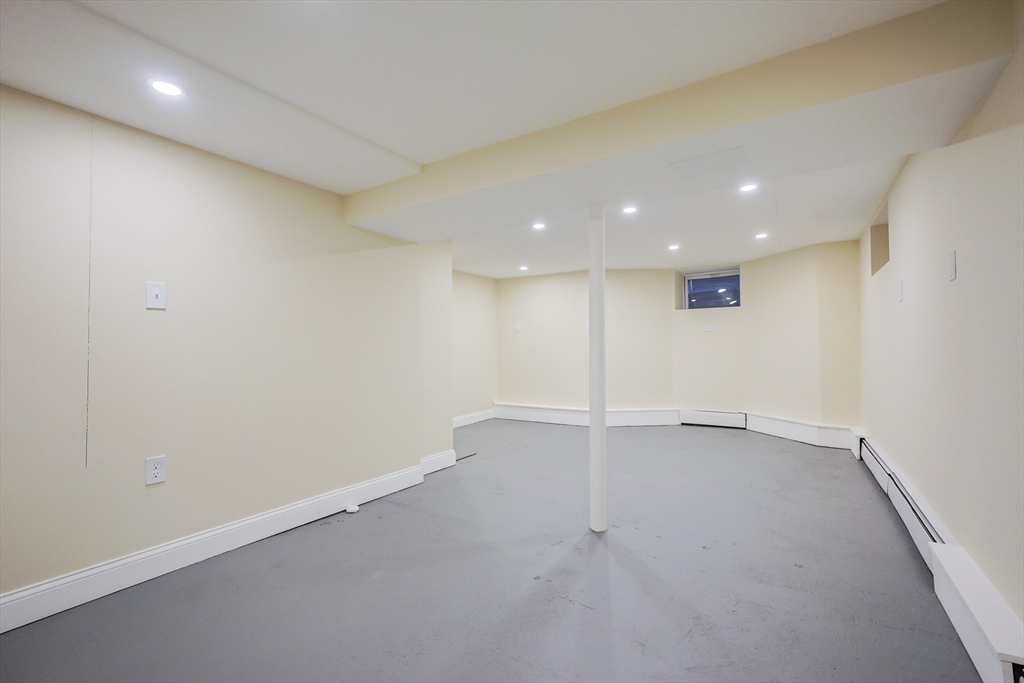 11 Hockanum Way Worcester, MA 01606 - Photo 28 of 36 an empty room with a empty space and windows