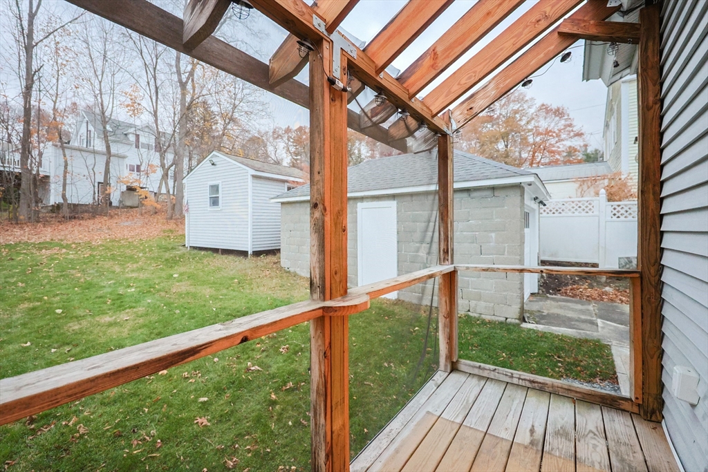 11 Hockanum Way Worcester, MA 01606 - Photo 32 of 36 a view of porch with a floor to ceiling window with wooden floor