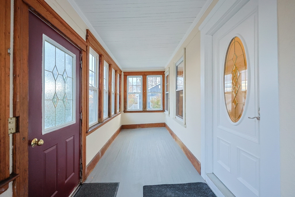 11 Hockanum Way Worcester, MA 01606 - Photo 4 of 36 a view of a hallway with wooden floor and door