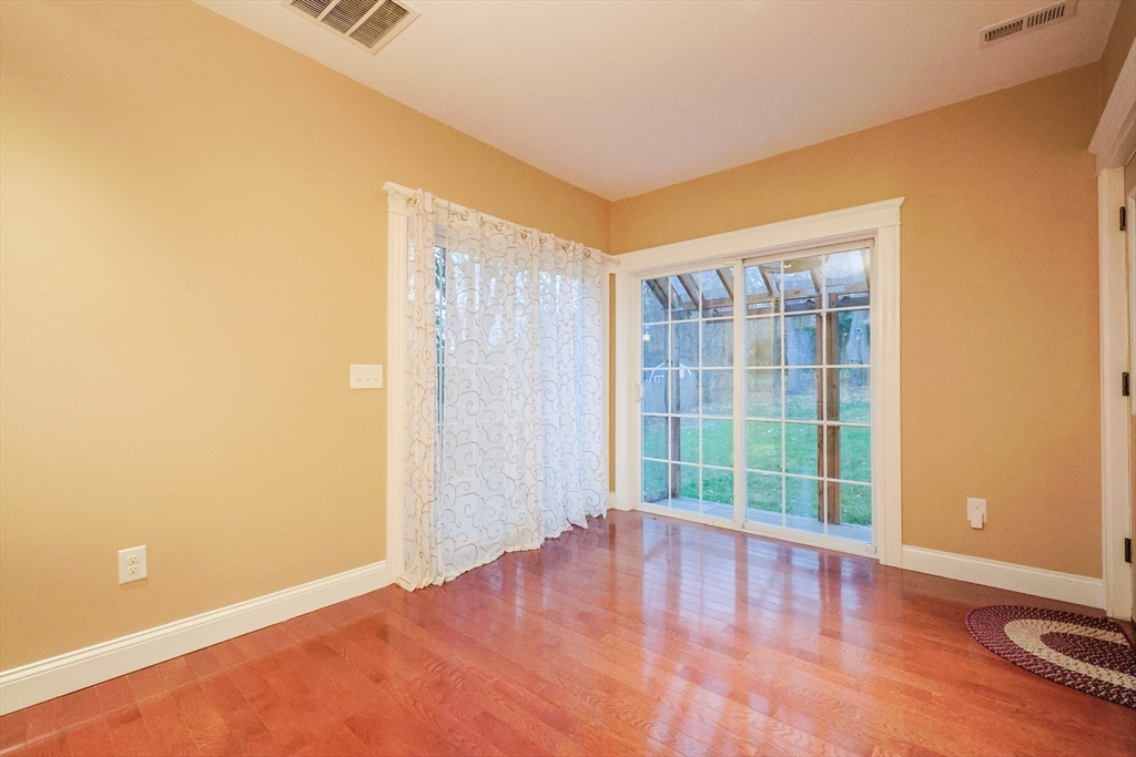 11 Hockanum Way Worcester, MA 01606 - Photo 9 of 36 an empty room with wooden floor and windows