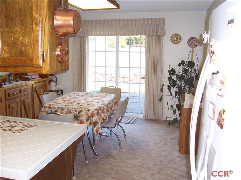 4413 Aquarius Road Lompoc, CA 93436 - Photo 13 of 19 a view of a dining room with furniture and a chandelier