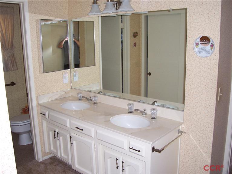 4413 Aquarius Road Lompoc, CA 93436 - Photo 19 of 19 a bathroom with a sink and a mirror