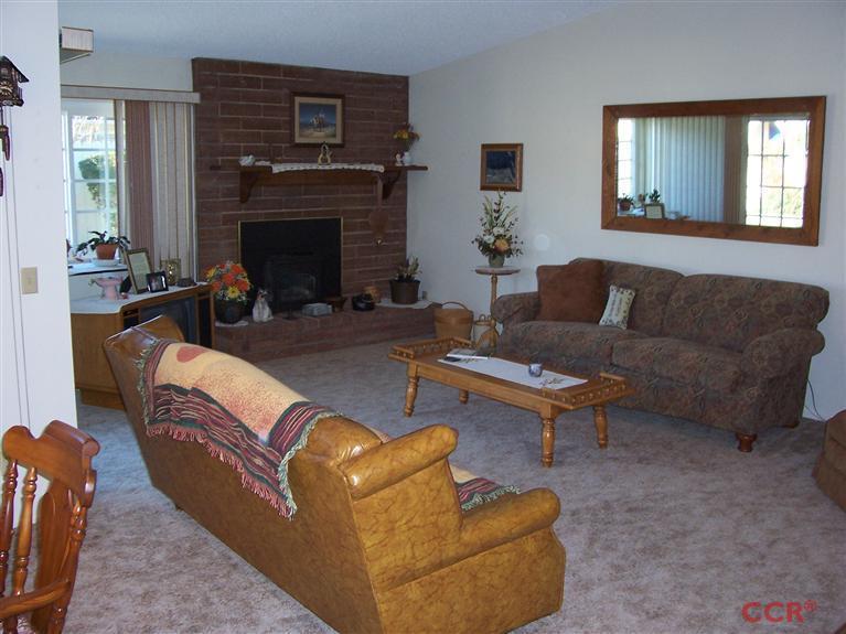 4413 Aquarius Road Lompoc, CA 93436 - Photo 10 of 19 a living room with furniture and a fireplace