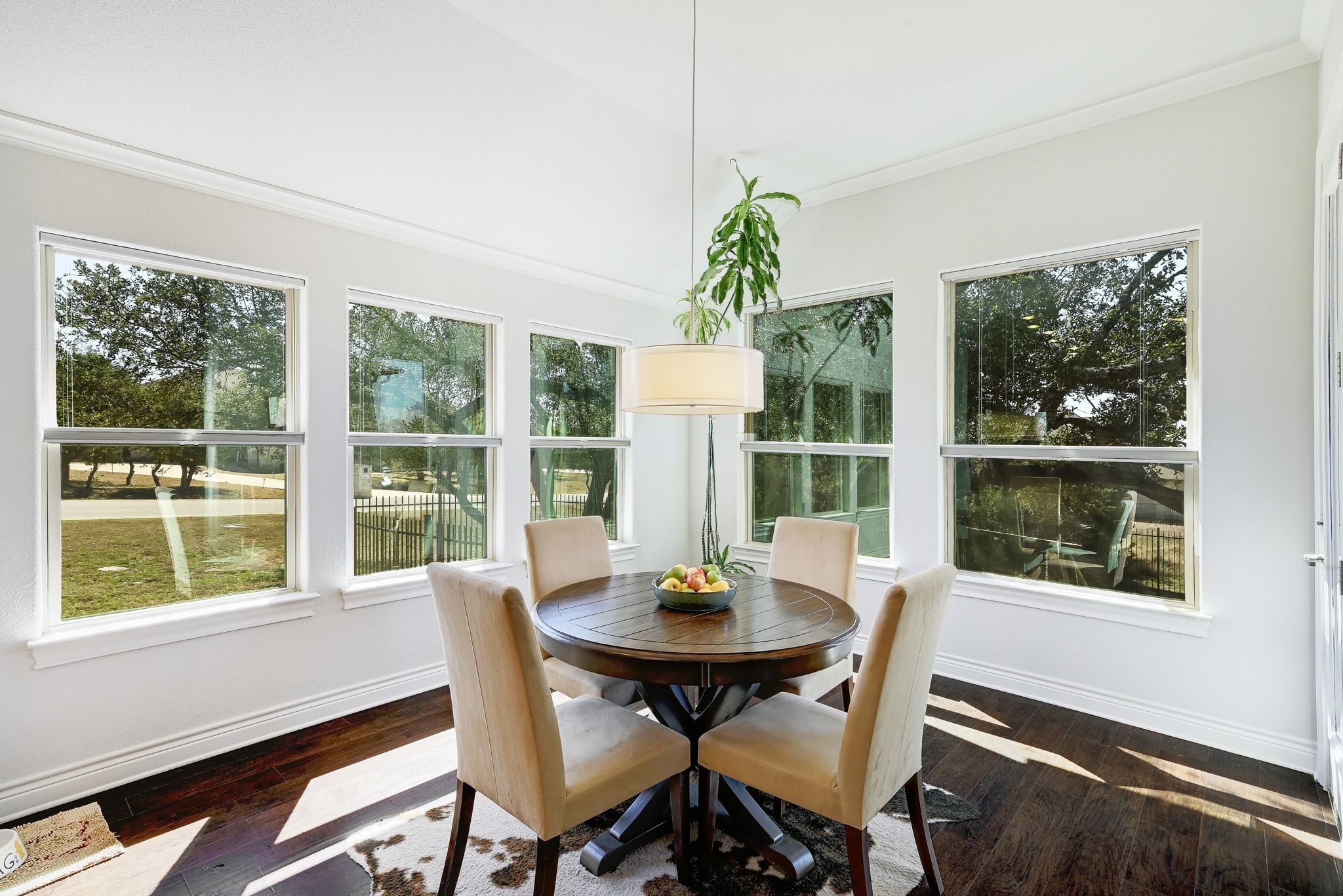 960 Blue Ridge Drive Dripping Springs, TX 78620 - Photo 10 of 38 Sunroom with hardwood / wood-style flooring and crown molding