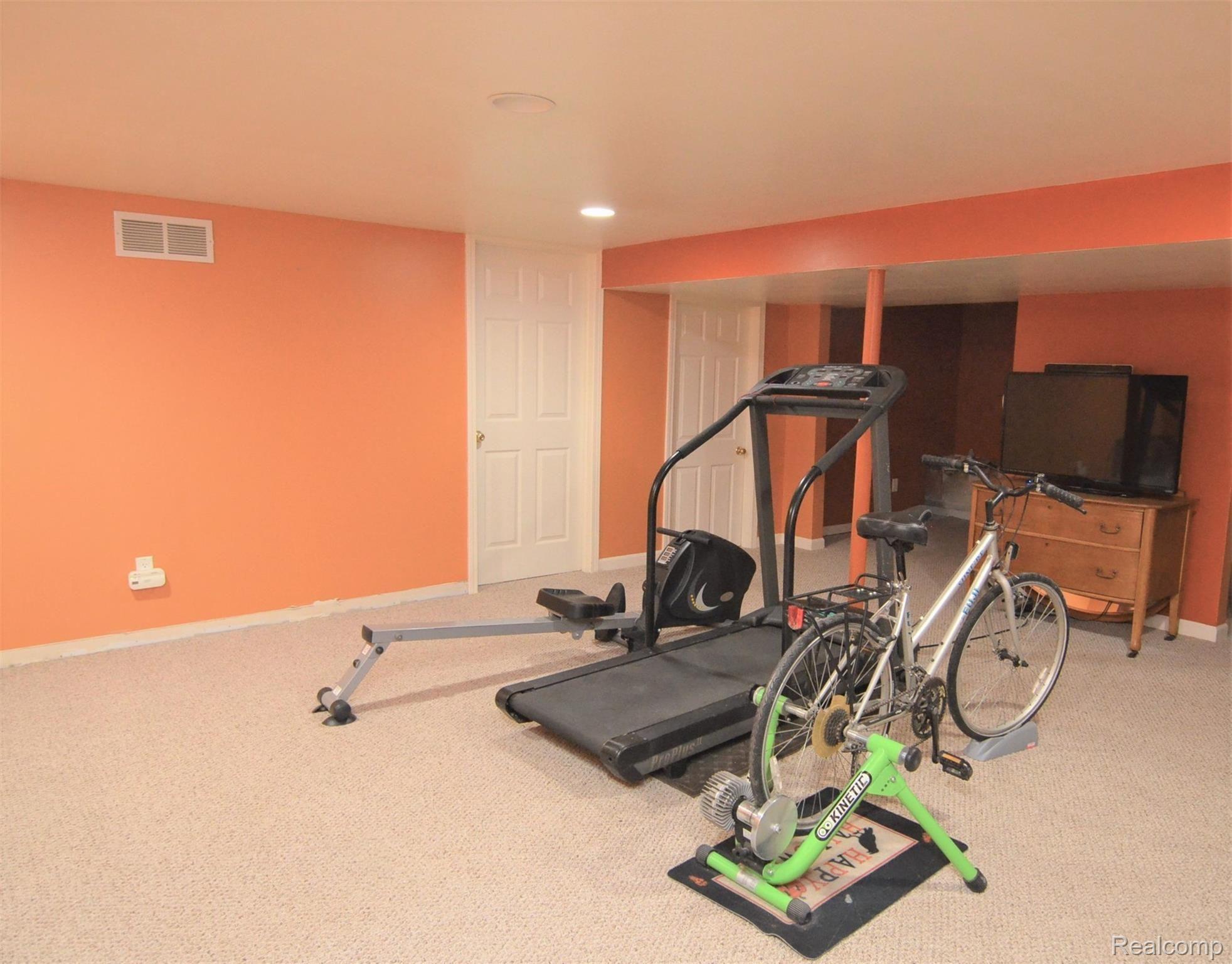 750 East Davis Road Howell, MI 48843 - Photo 16 of 21 FUN FINISHED BASEMENT~ROOM FOR ALL YOUR HOBBIES