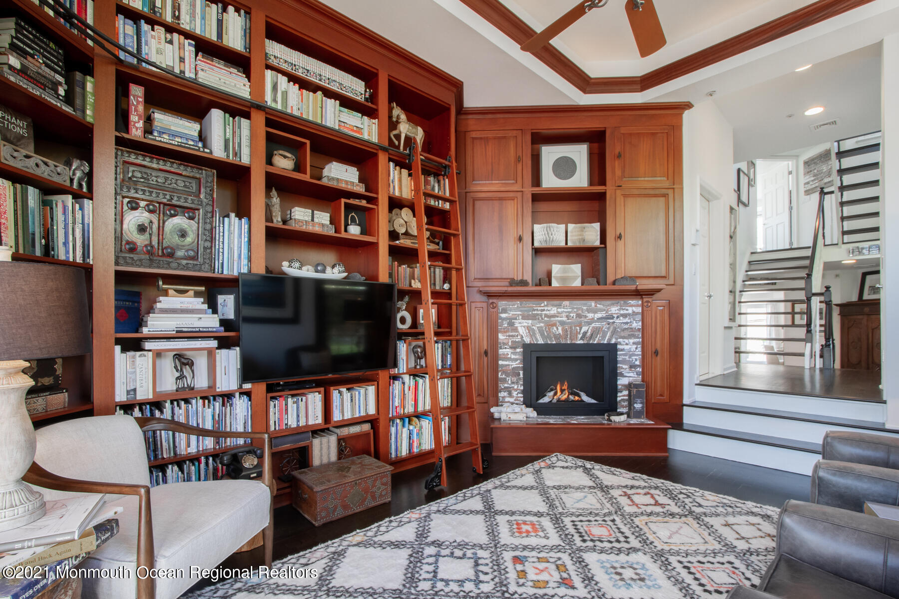 62 B West Front Street Red Bank, NJ 07701 - Photo 15 of 45 a living room with fireplace furniture and a book shelf