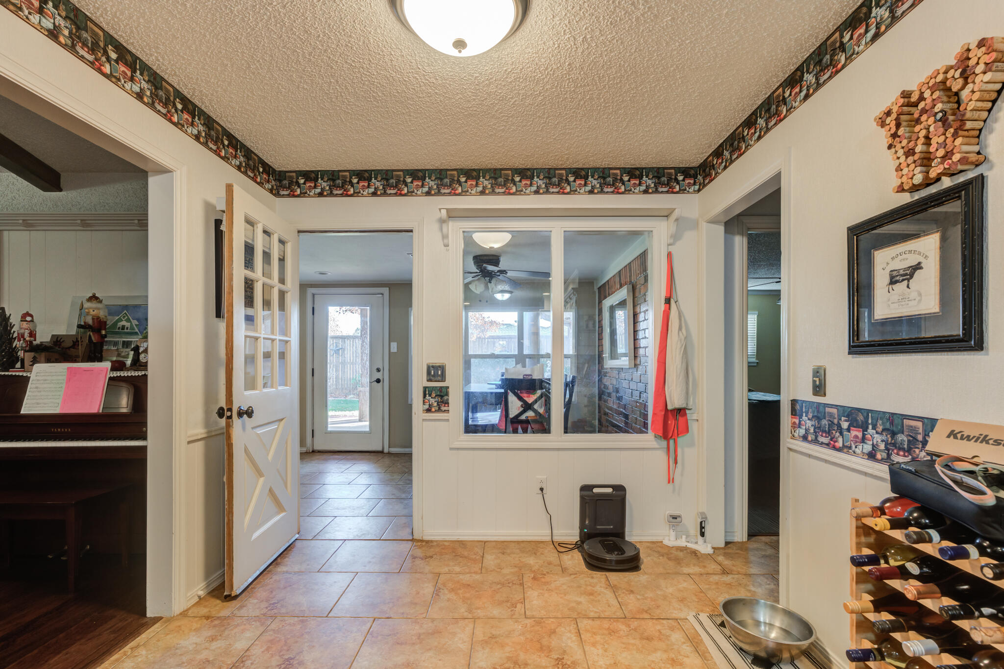 5713 76th Street Lubbock, TX 79424 - Photo 16 of 62 a view of a hallway with dining area