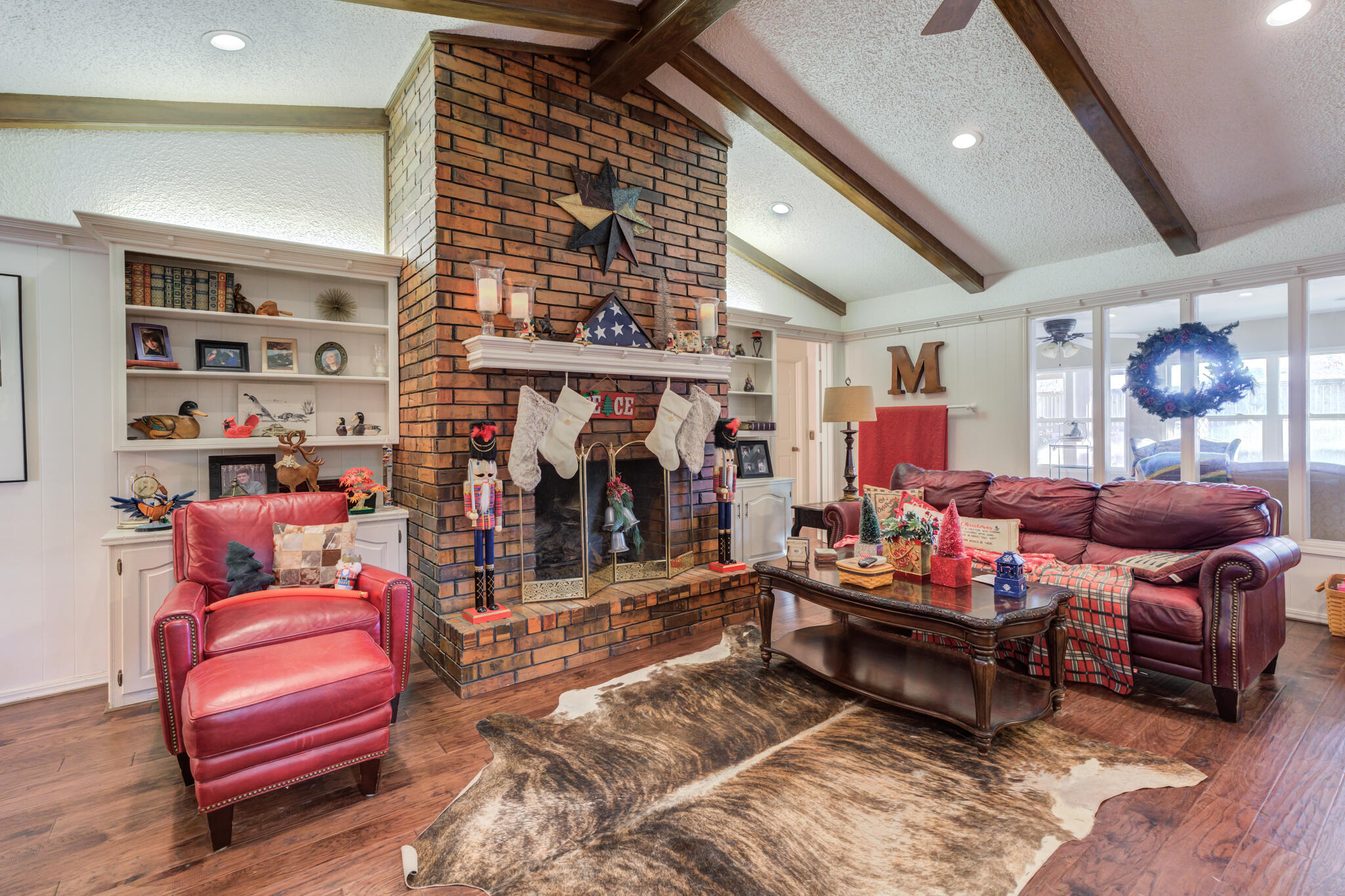 5713 76th Street Lubbock, TX 79424 - Photo 19 of 62 a living room with furniture a rug and a wall painting