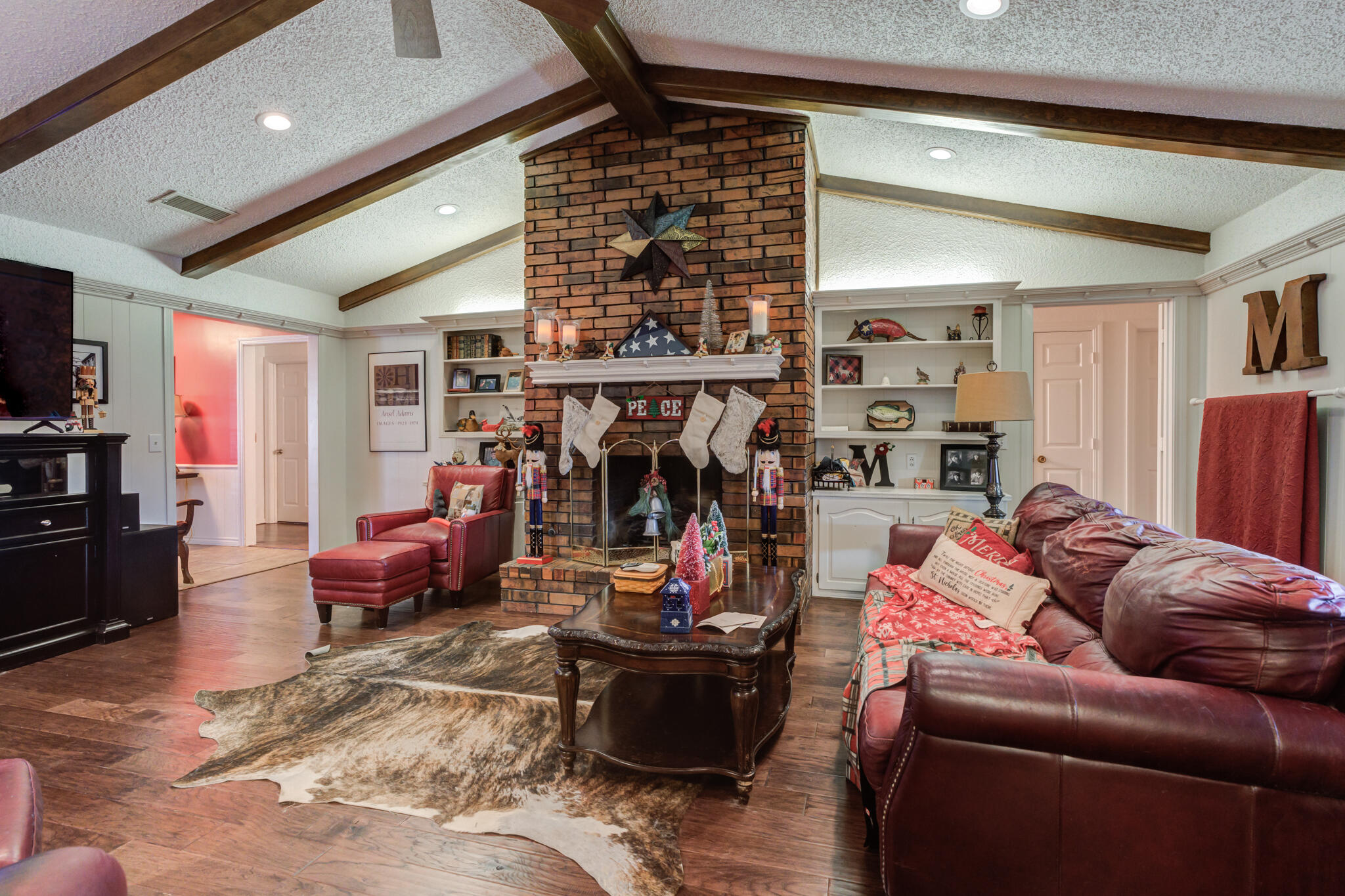 5713 76th Street Lubbock, TX 79424 - Photo 21 of 62 a living room with furniture and a ceiling fan