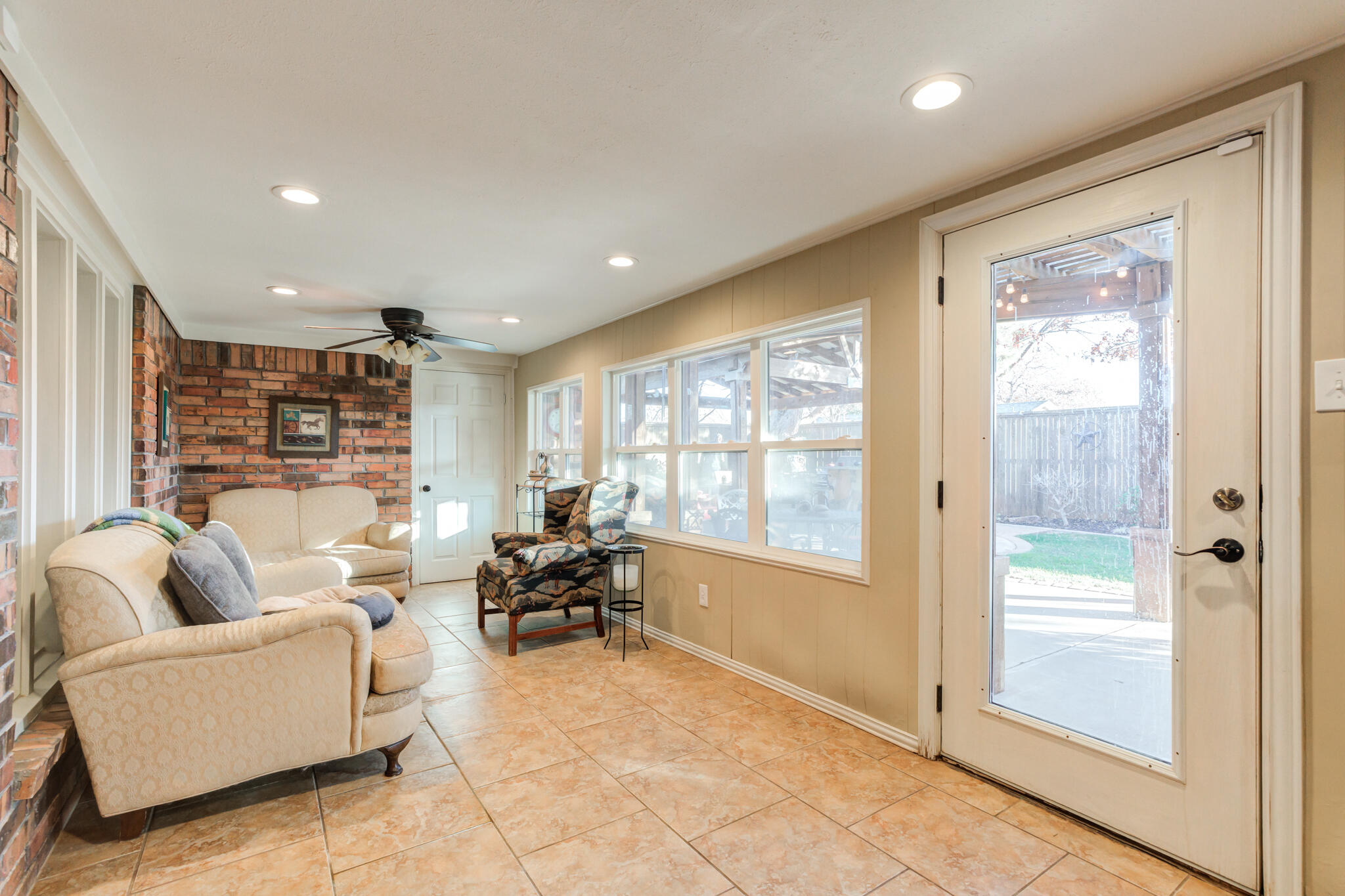 5713 76th Street Lubbock, TX 79424 - Photo 23 of 62 a living room with furniture and a large window