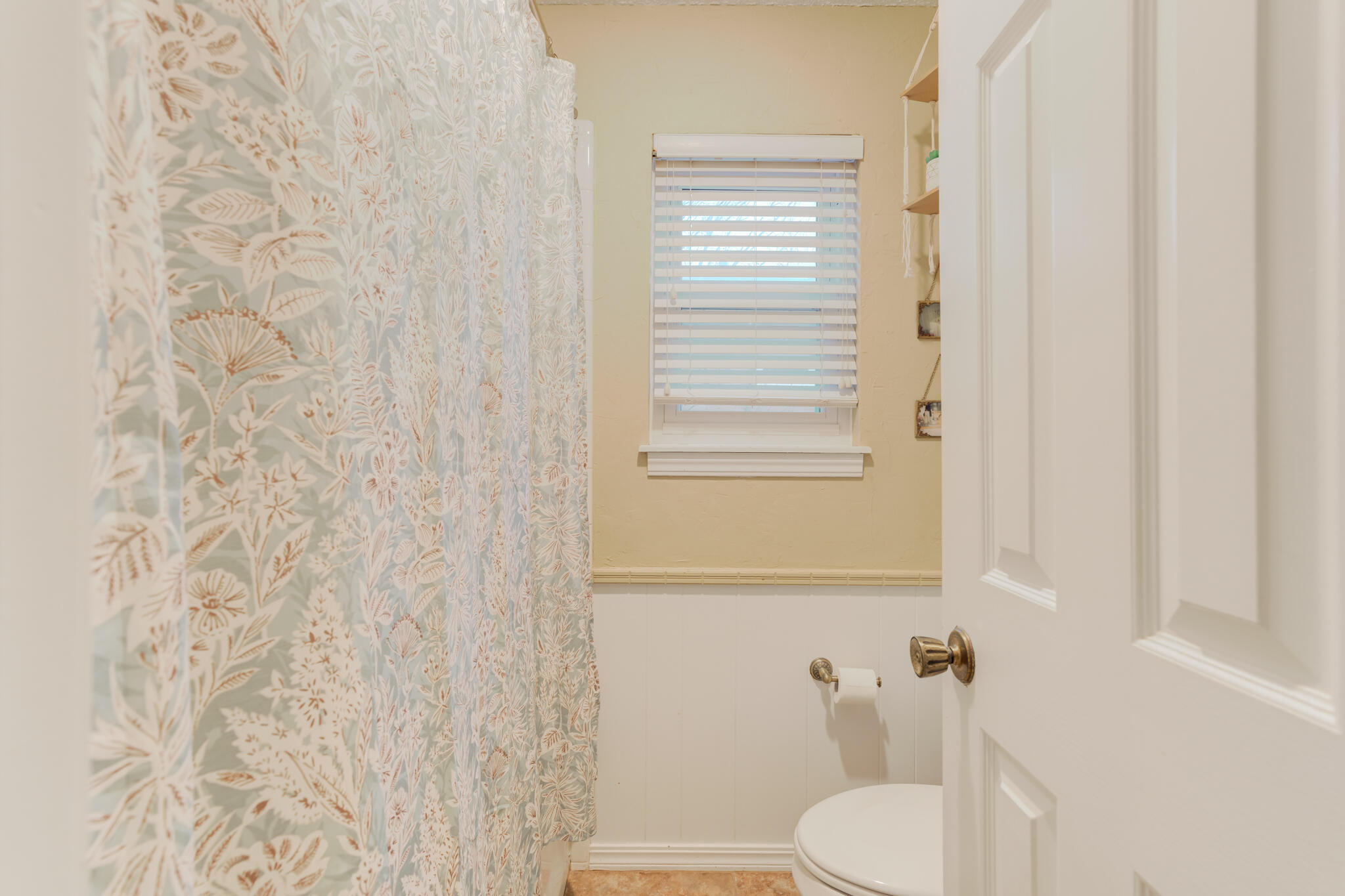 5713 76th Street Lubbock, TX 79424 - Photo 38 of 62 a white toilet sitting next to a bathroom sink