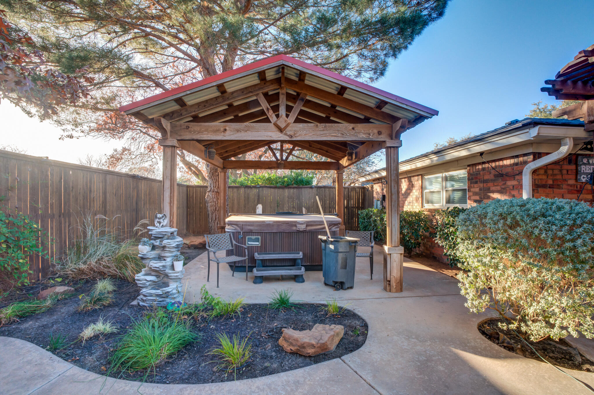5713 76th Street Lubbock, TX 79424 - Photo 49 of 62 a view of a chair and table in backyard of the house