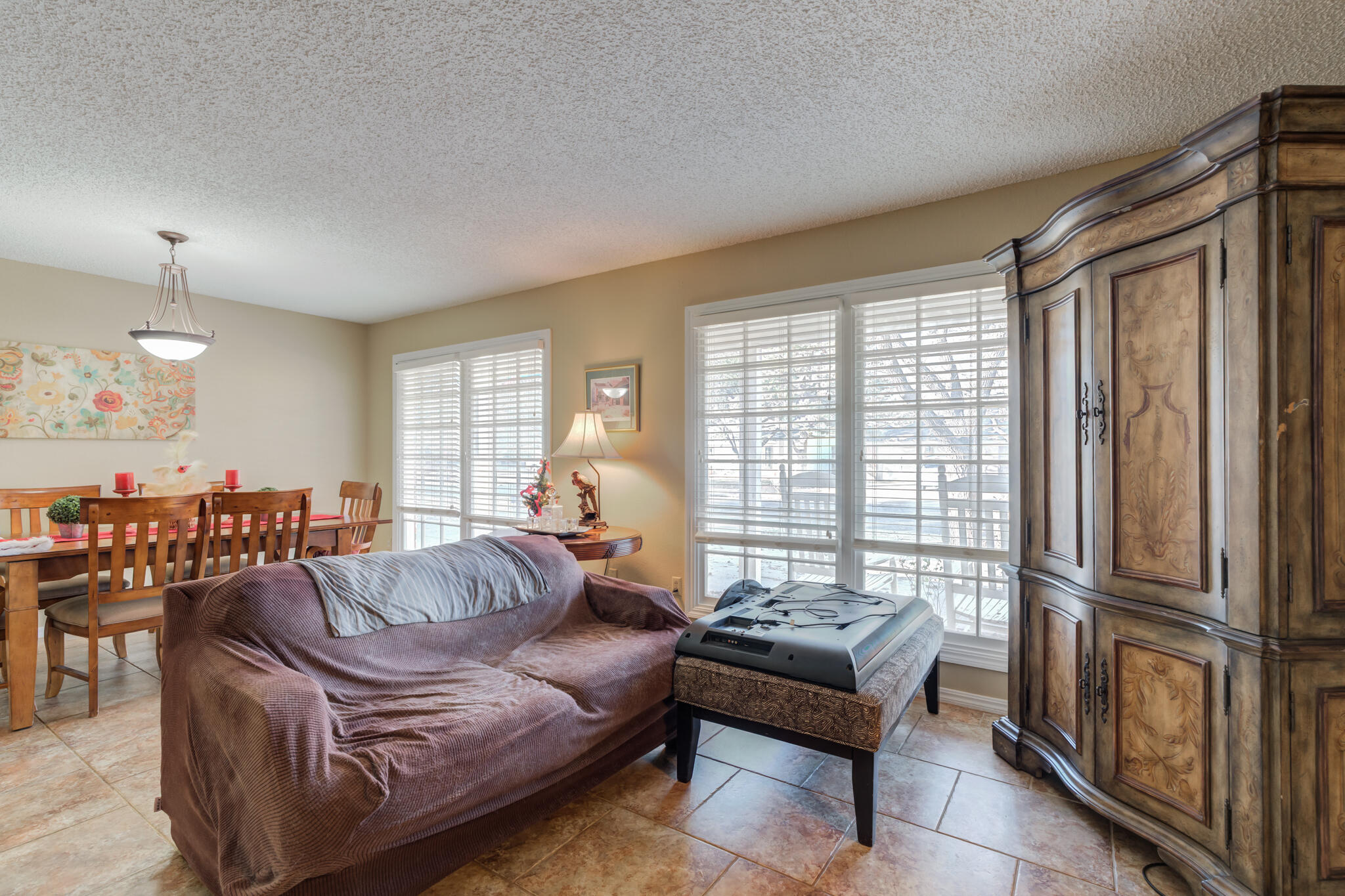 5713 76th Street Lubbock, TX 79424 - Photo 8 of 62 a living room with furniture and a large window