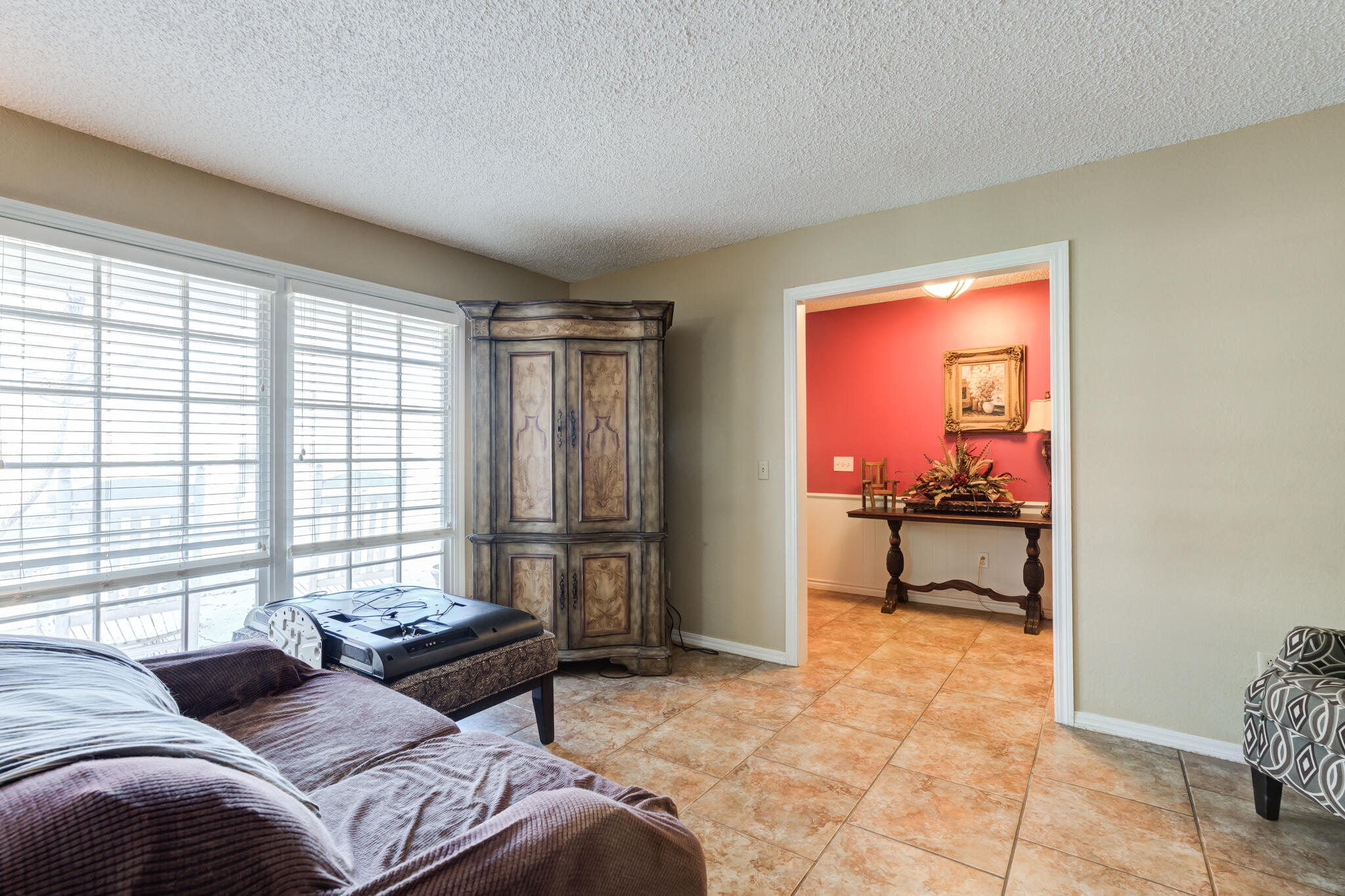 5713 76th Street Lubbock, TX 79424 - Photo 9 of 62 a bedroom with a bed and a window
