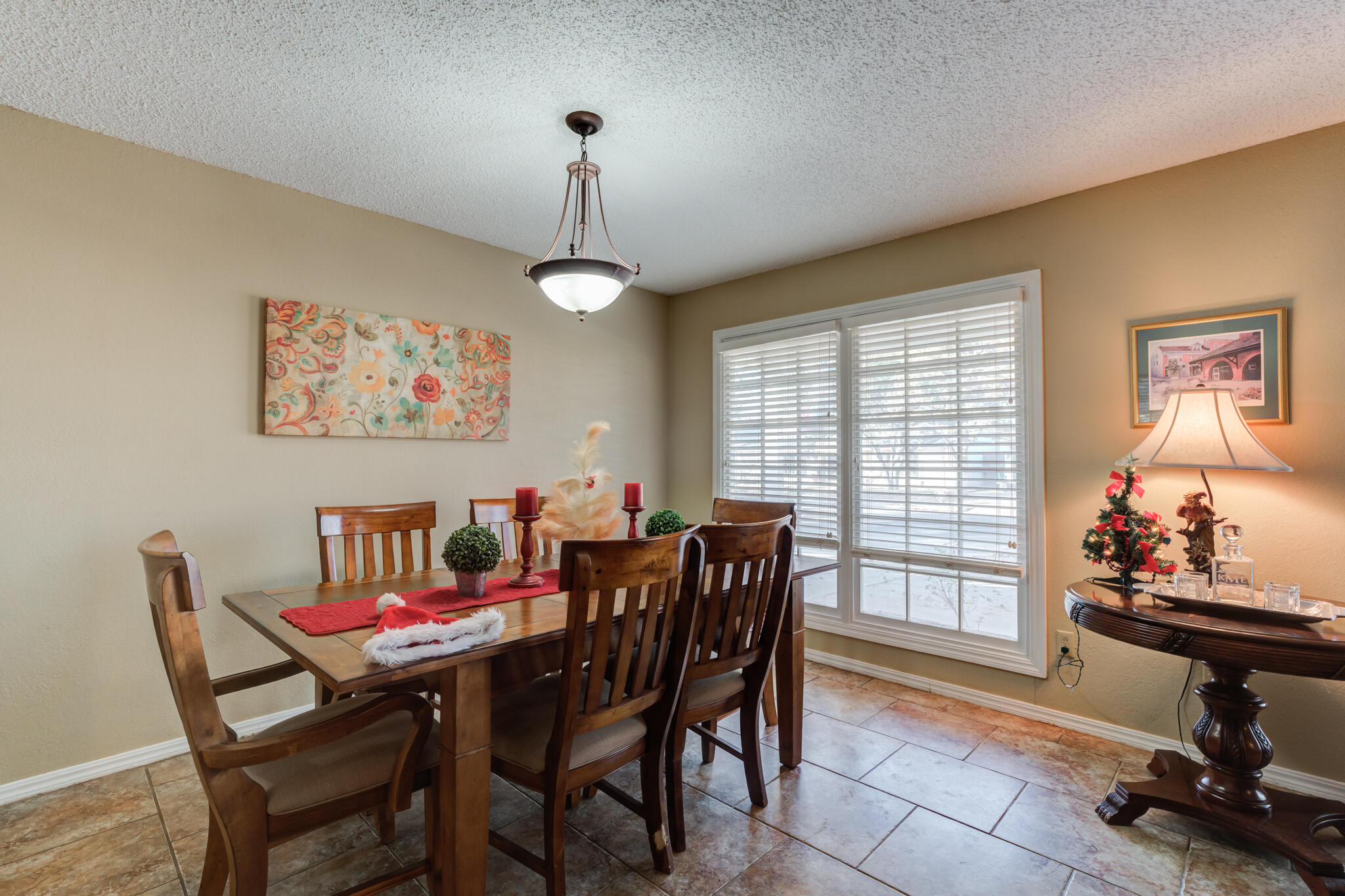5713 76th Street Lubbock, TX 79424 - Photo 10 of 62 a view of a dining room with furniture and a window