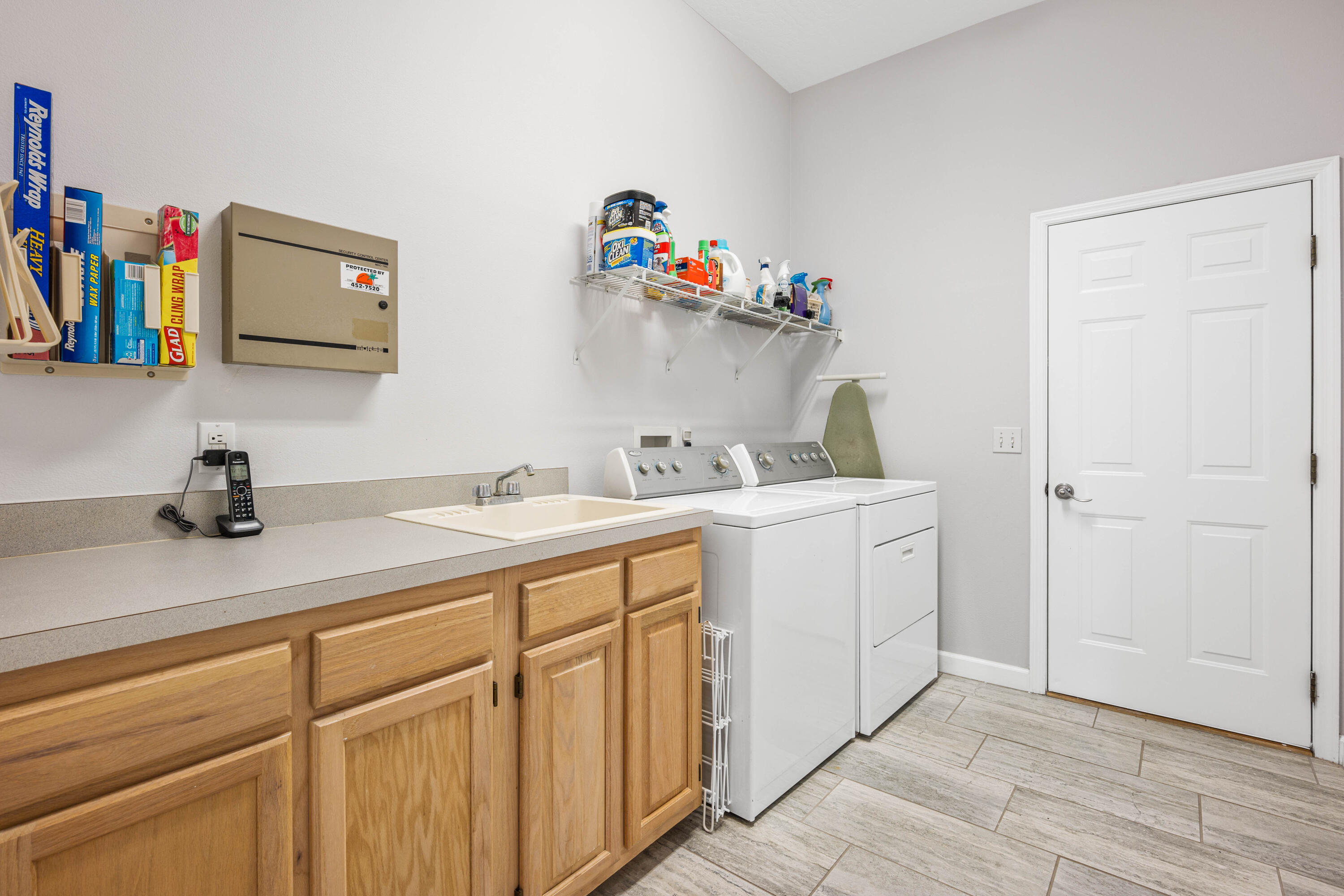 3455 Shady Run Road Melbourne, FL 32934 - Photo 16 of 47 a utility room with sink dryer and washer