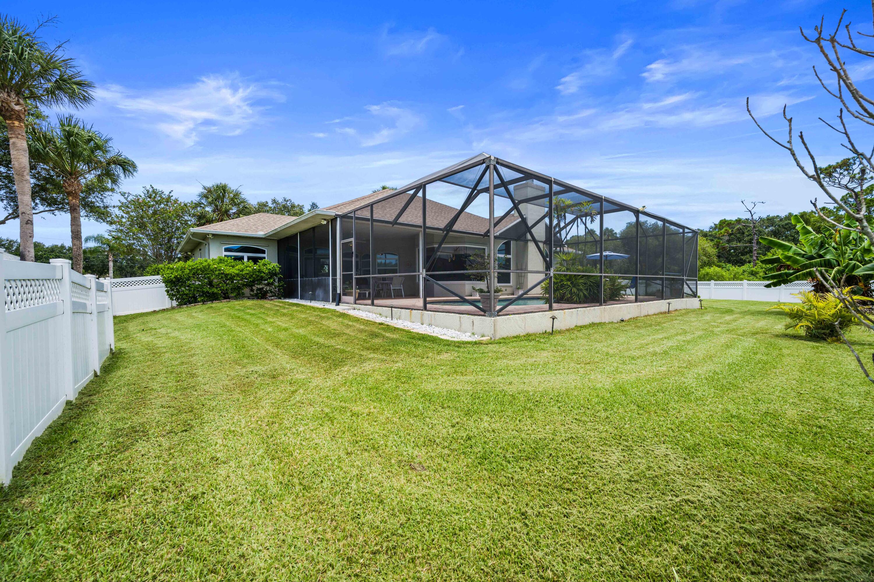3455 Shady Run Road Melbourne, FL 32934 - Photo 23 of 47 a view of a house with a yard patio and fire pit