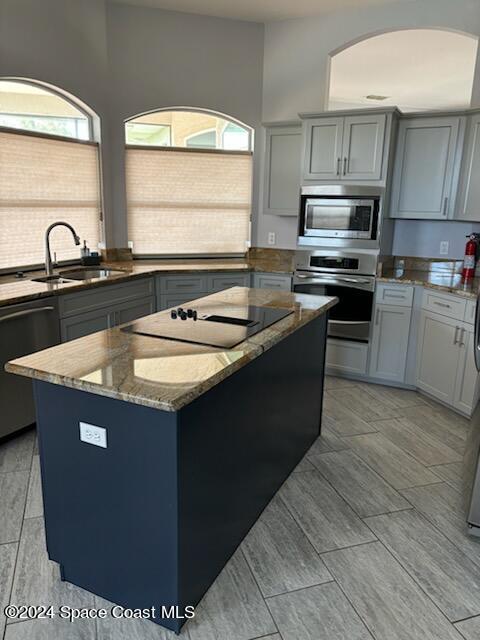 3455 Shady Run Road Melbourne, FL 32934 - Photo 9 of 47 a kitchen with kitchen island granite countertop a sink a counter top space appliances and cabinets