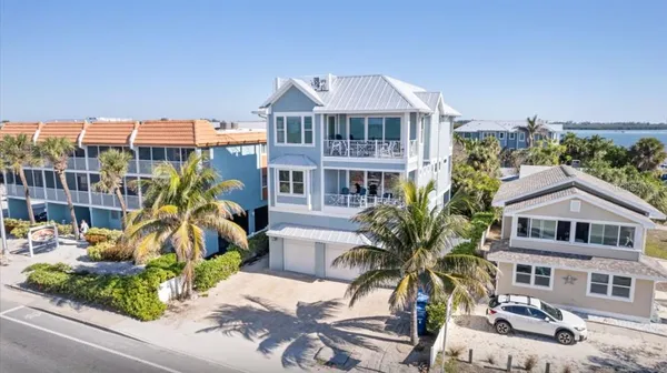 a front view of a residential apartment building with a yard