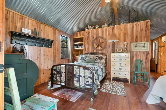 a bedroom with furniture and a window