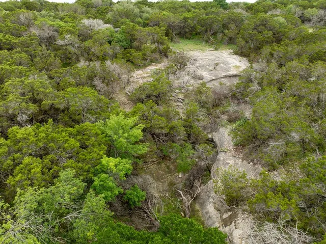 a view of an ocean beach and mountain