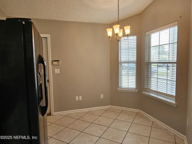 a view of a bathroom from a hallway