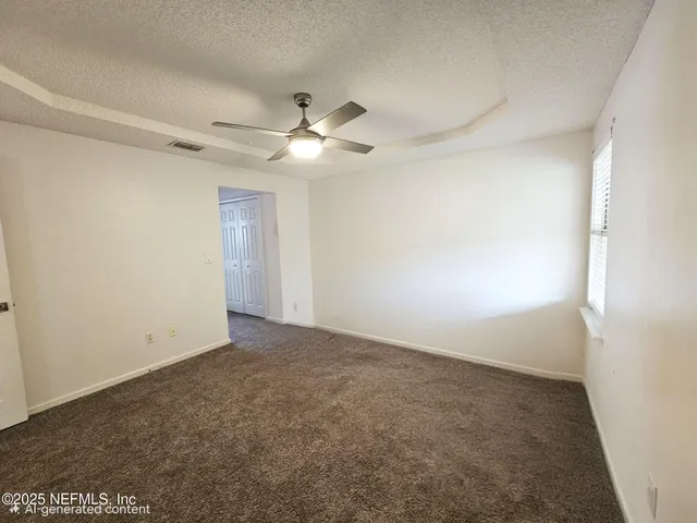 a bathroom with a granite countertop sink a mirror and shower