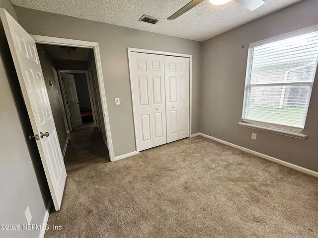 a view of an empty room and entryway