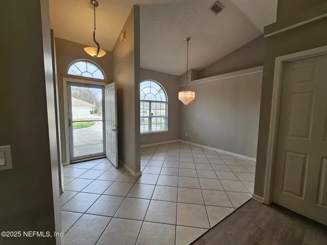 a view of an empty room and window