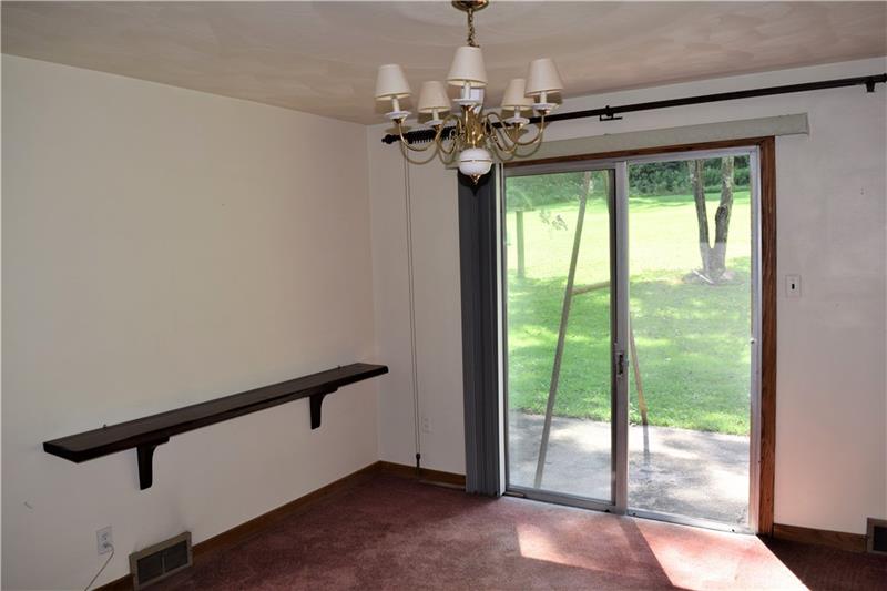 1035 Indian Creek Valley Road Normalville, PA 15469 - Photo 14 of 25 FROM THE KITCHEN, STEP INTO THE DINING ROOM!
