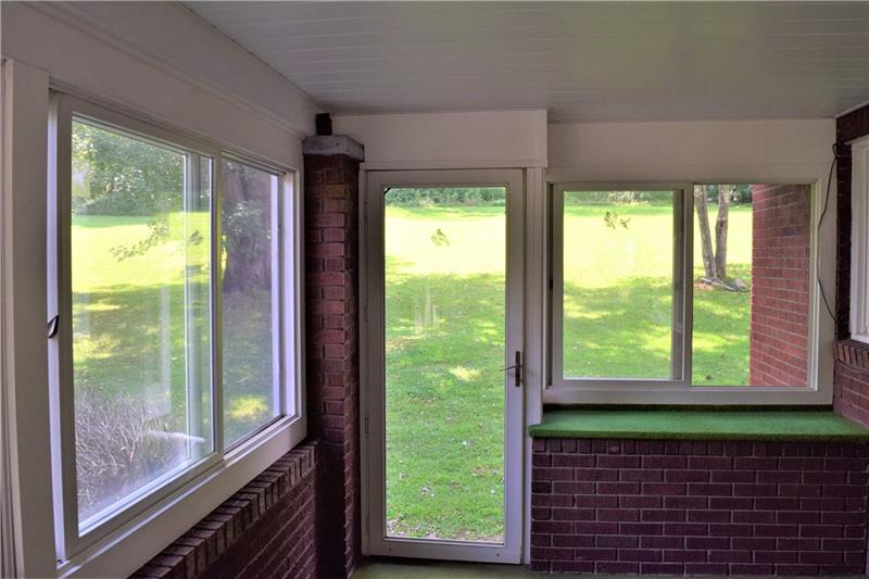 1035 Indian Creek Valley Road Normalville, PA 15469 - Photo 8 of 25 FROM THE BACK YARD, ENTER INTO THE ENCLOSED BACK PORCH!