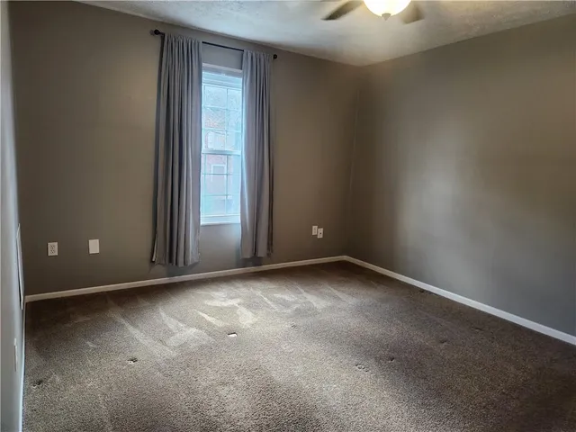 an empty room with a empty space and a window