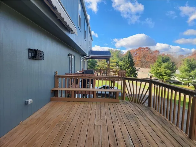 a view of a balcony with wooden floor