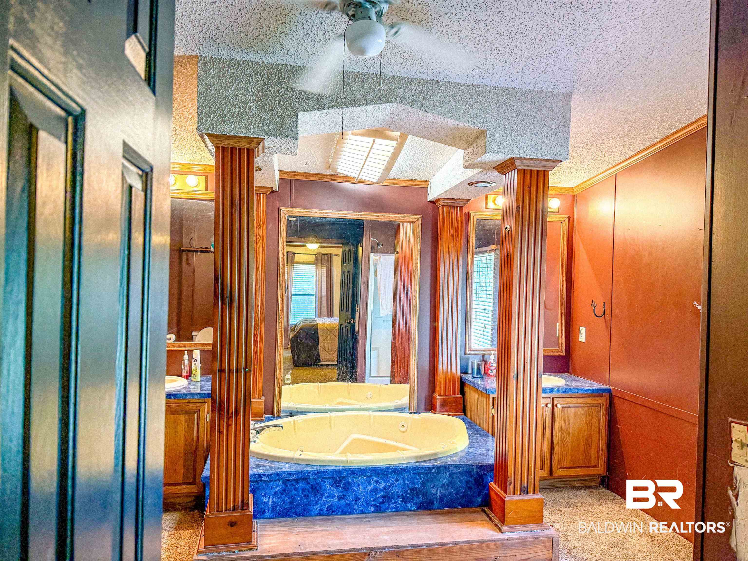 3346 Hoomesville Road Brewton, AL 36426 - Photo 16 of 16 Full bath with a textured ceiling, a bath, vanity, crown molding, and light carpet