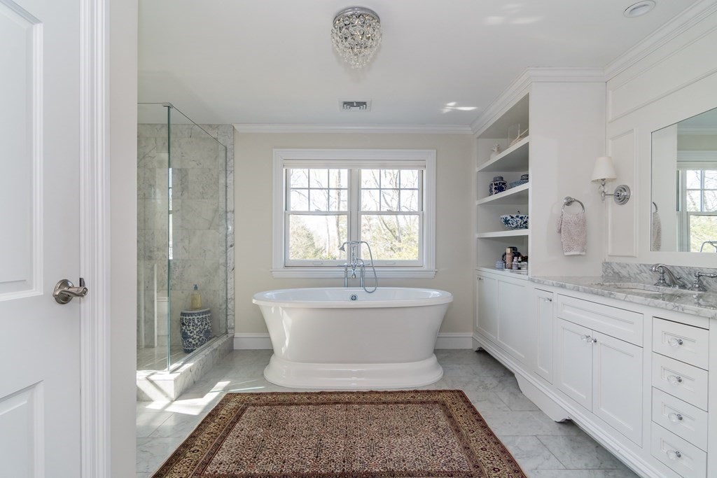 92 Old Colony Road Wellesley, MA 02481 - Photo 13 of 28 a spacious bathroom with a bathtub shower sink mirror and toilet