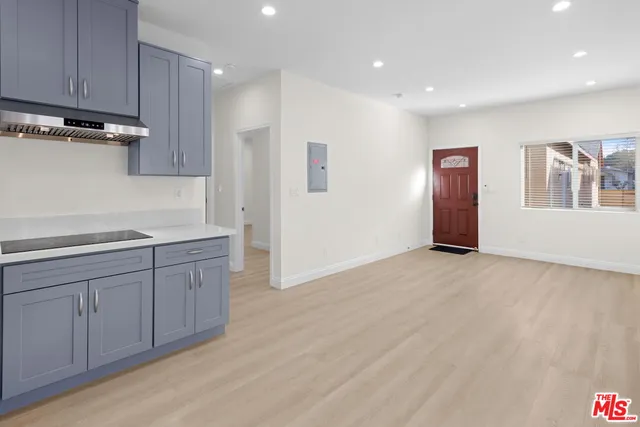 a view of a kitchen with a sink cabinets and a window