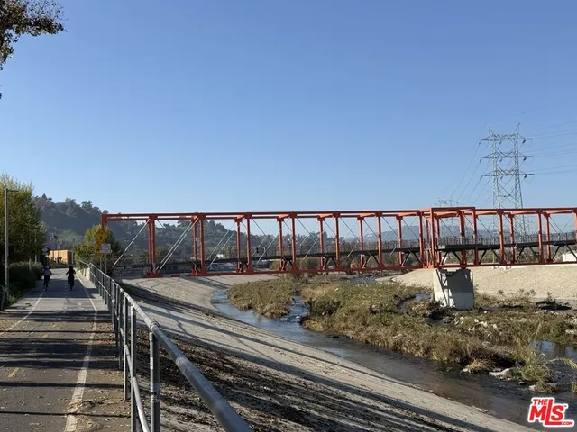 a view of a swimming pool with a yard