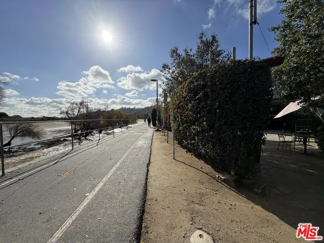 a view of a street with sitting area