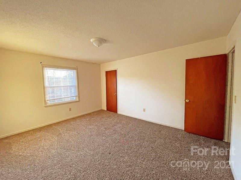 4887 County Home Road, Unit D3 Conover, NC 28613 - Photo 5 of 7 an empty room with windows