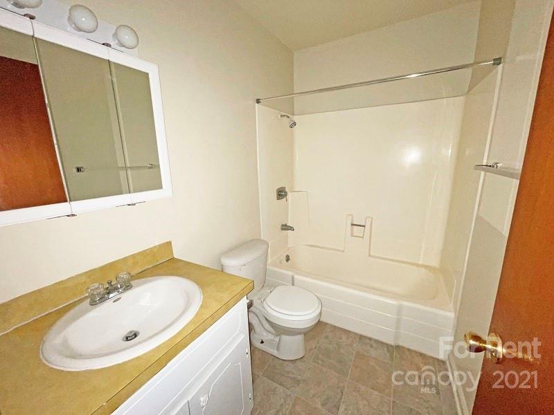 4887 County Home Road, Unit D3 Conover, NC 28613 - Photo 6 of 7 a bathroom with a sink a toilet and shower